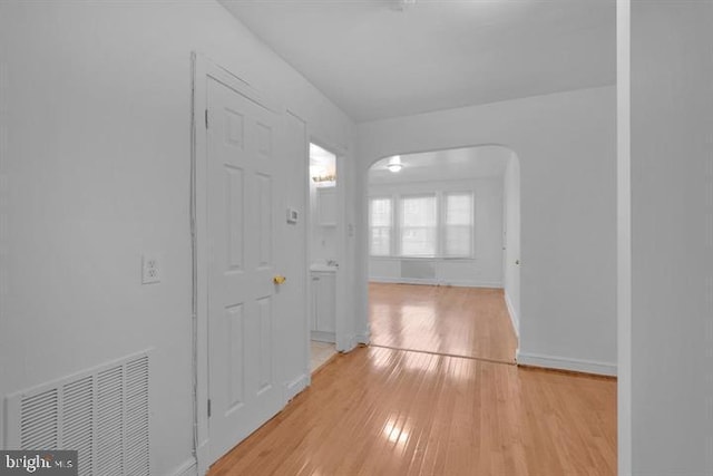 hall with light wood-type flooring