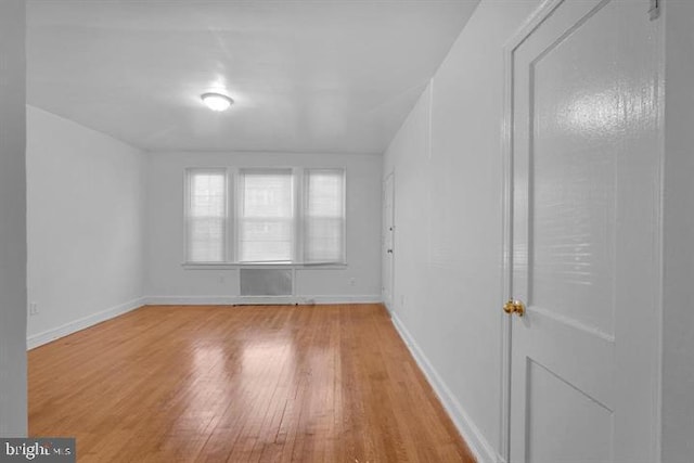 spare room with light wood-type flooring