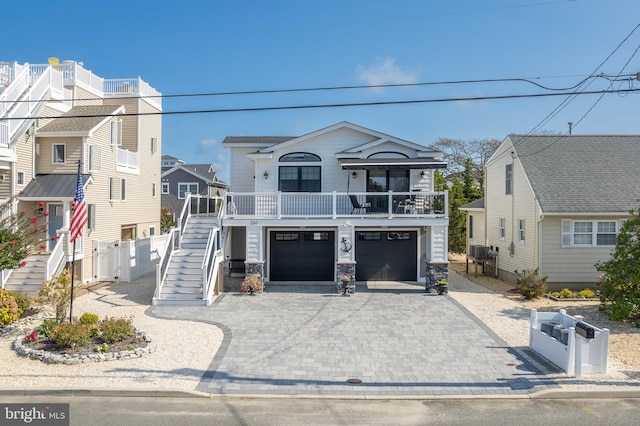 view of front of home with covered porch and a garage