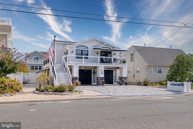 view of front of house with a garage and a balcony