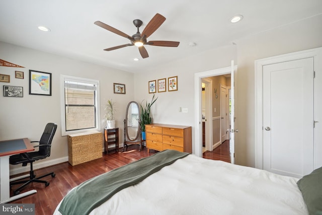 bedroom featuring ceiling fan and dark hardwood / wood-style floors