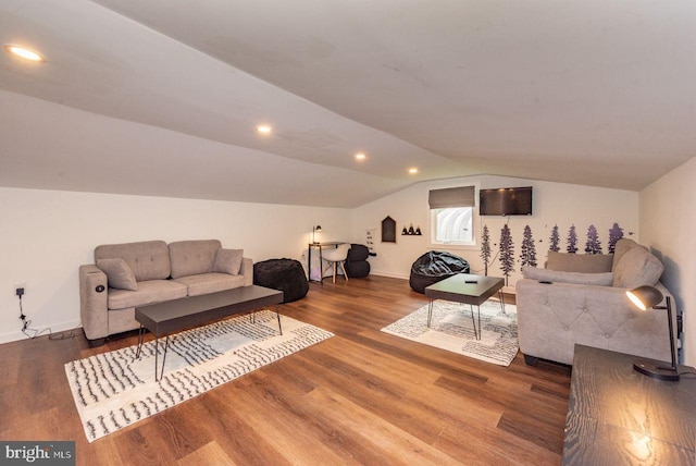 living room with lofted ceiling and hardwood / wood-style floors