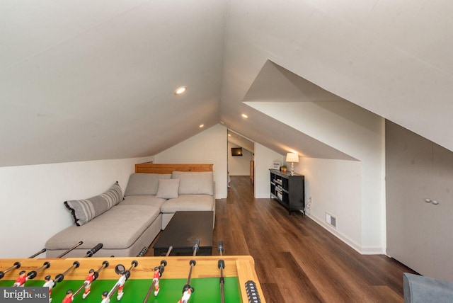 playroom with vaulted ceiling and dark hardwood / wood-style flooring