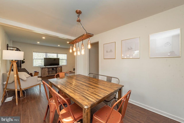 dining area featuring dark wood-type flooring