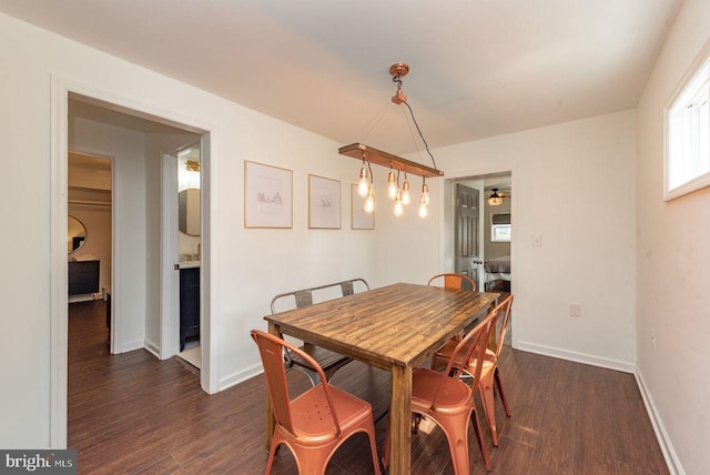 dining room with dark wood-type flooring and ceiling fan