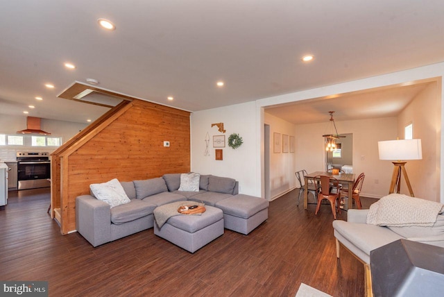 living room with dark hardwood / wood-style flooring