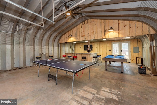 game room featuring concrete floors, vaulted ceiling, and billiards