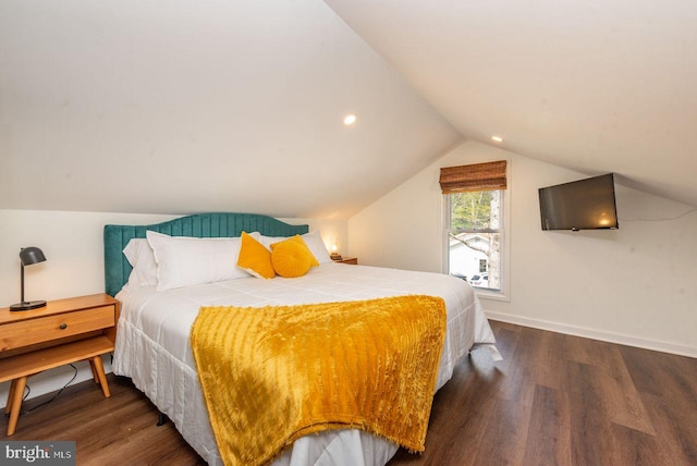 bedroom with dark hardwood / wood-style floors and vaulted ceiling