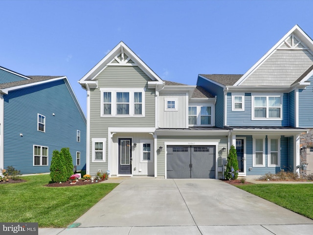 view of front of property featuring a garage and a front yard