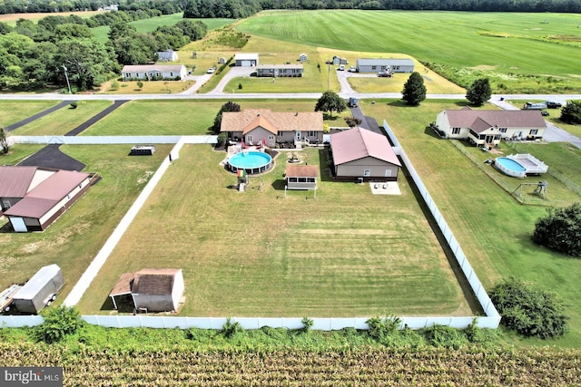 birds eye view of property with a rural view