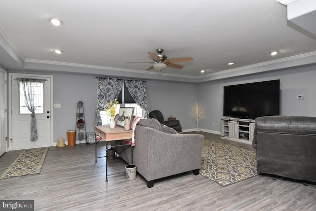 living room with crown molding, ceiling fan, and hardwood / wood-style flooring