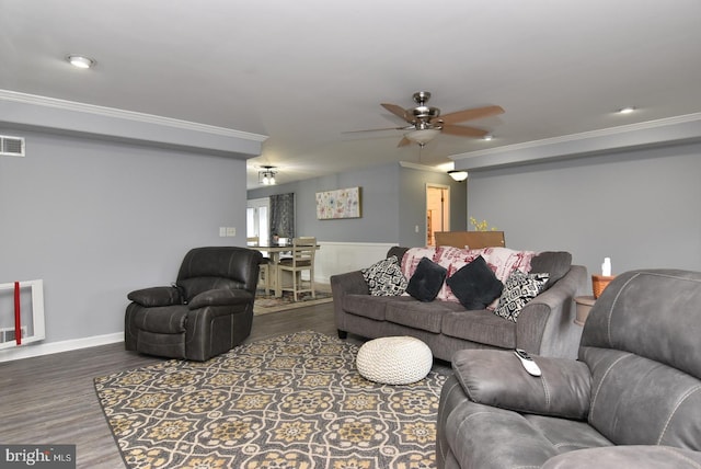 living room with ceiling fan, dark hardwood / wood-style floors, and crown molding