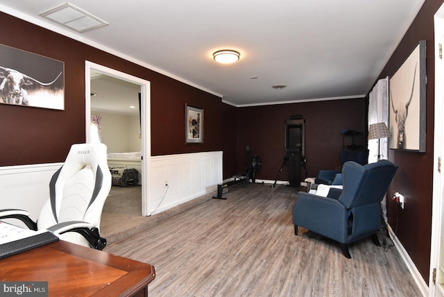 office space with crown molding and hardwood / wood-style flooring