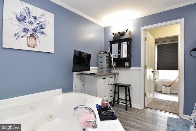 bathroom featuring crown molding, a bath, and wood-type flooring