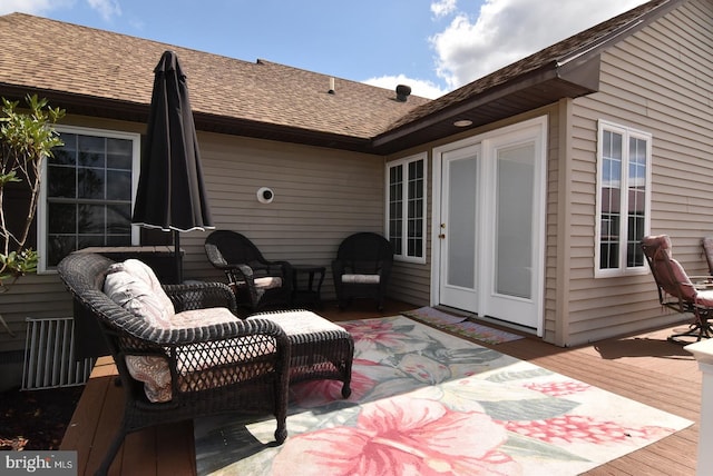 wooden deck featuring french doors