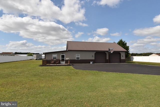 view of front of house with a wooden deck and a front yard