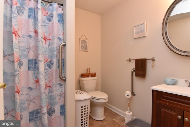 bathroom featuring a shower with curtain, toilet, and vanity