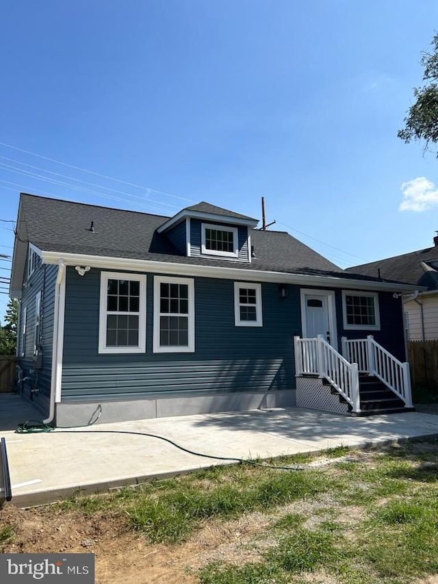 back of property with a patio area