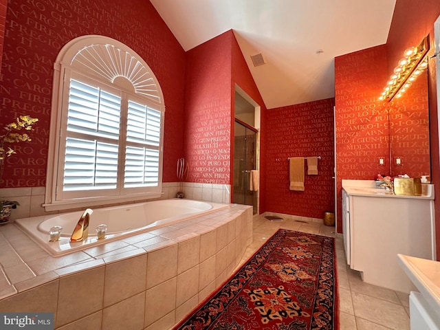 full bath with a stall shower, visible vents, tile patterned flooring, vaulted ceiling, and vanity