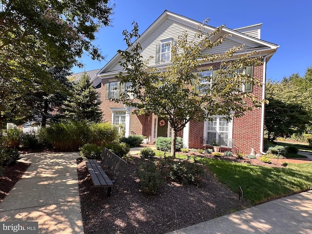 view of front facade featuring brick siding