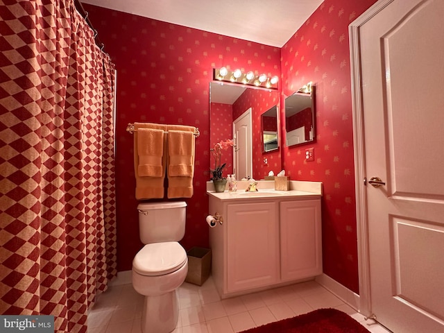 bathroom featuring tile patterned floors, vanity, toilet, and wallpapered walls