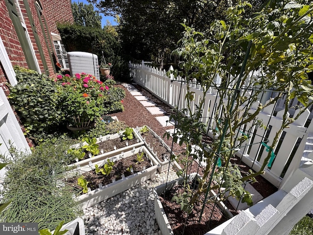 view of yard with a garden and fence