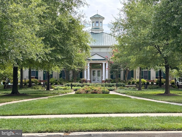 view of community featuring a yard