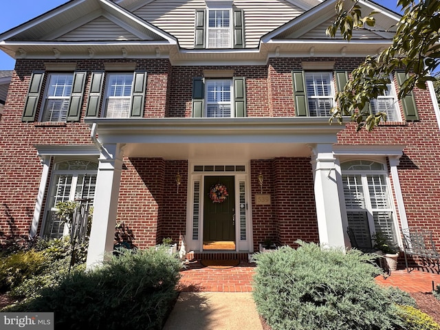 view of front of home with brick siding