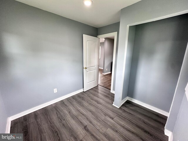 empty room with wood-type flooring