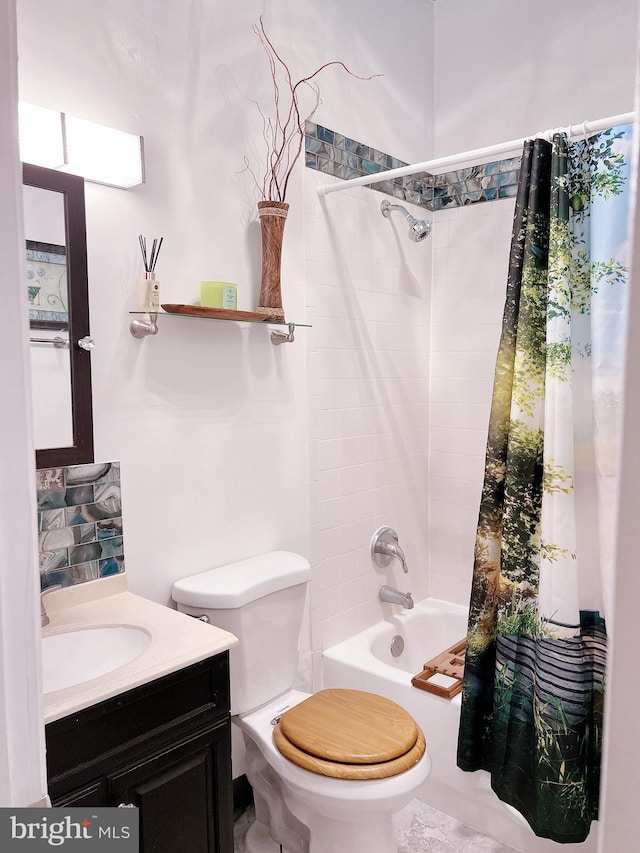 full bathroom featuring vanity, shower / bath combo, and toilet