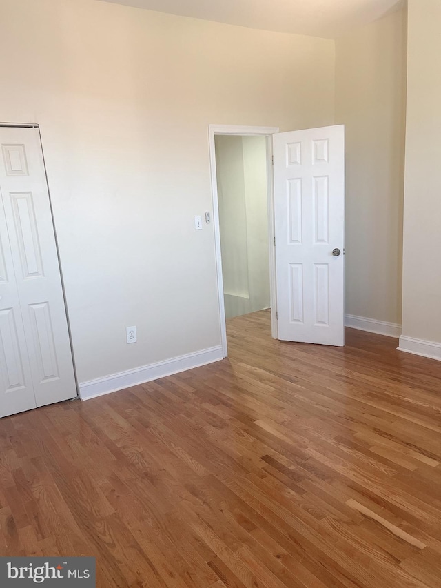 spare room featuring hardwood / wood-style floors