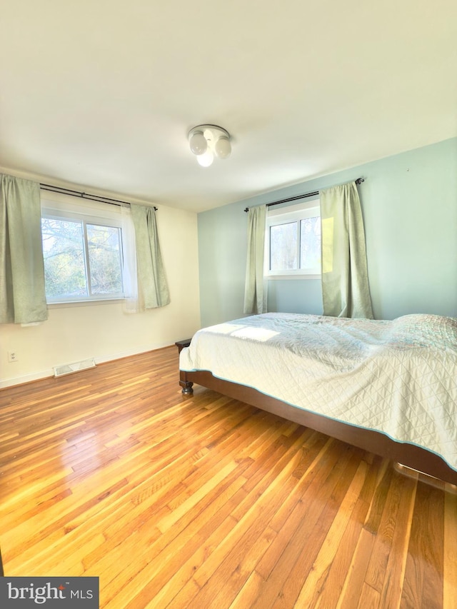 bedroom featuring hardwood / wood-style flooring