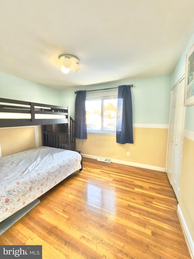 unfurnished bedroom with wood-type flooring