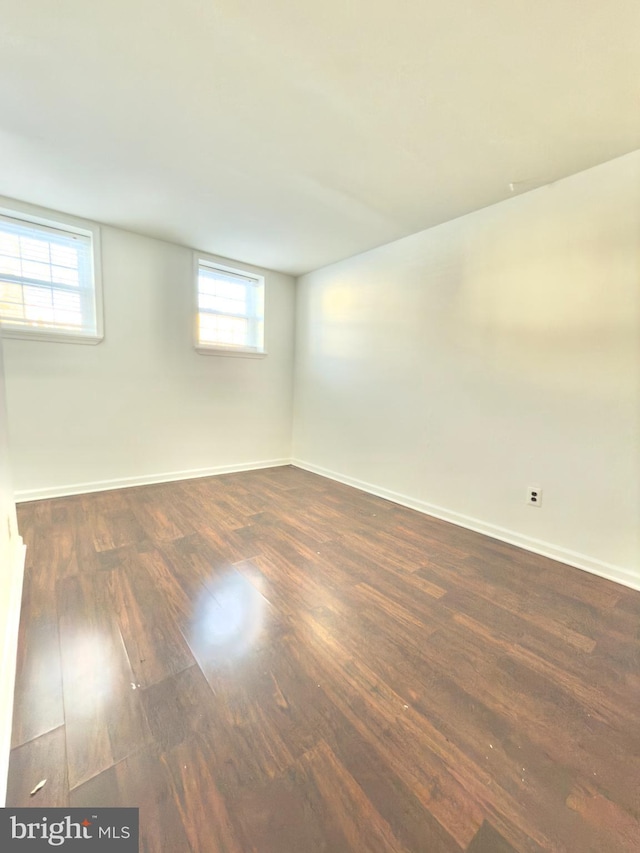 spare room featuring dark hardwood / wood-style flooring