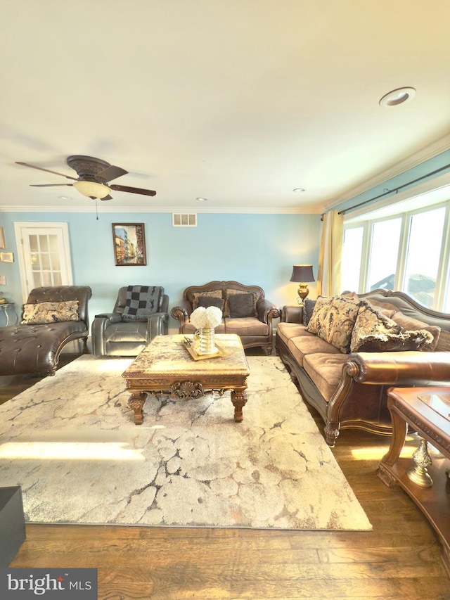 living room featuring crown molding, dark hardwood / wood-style floors, and ceiling fan