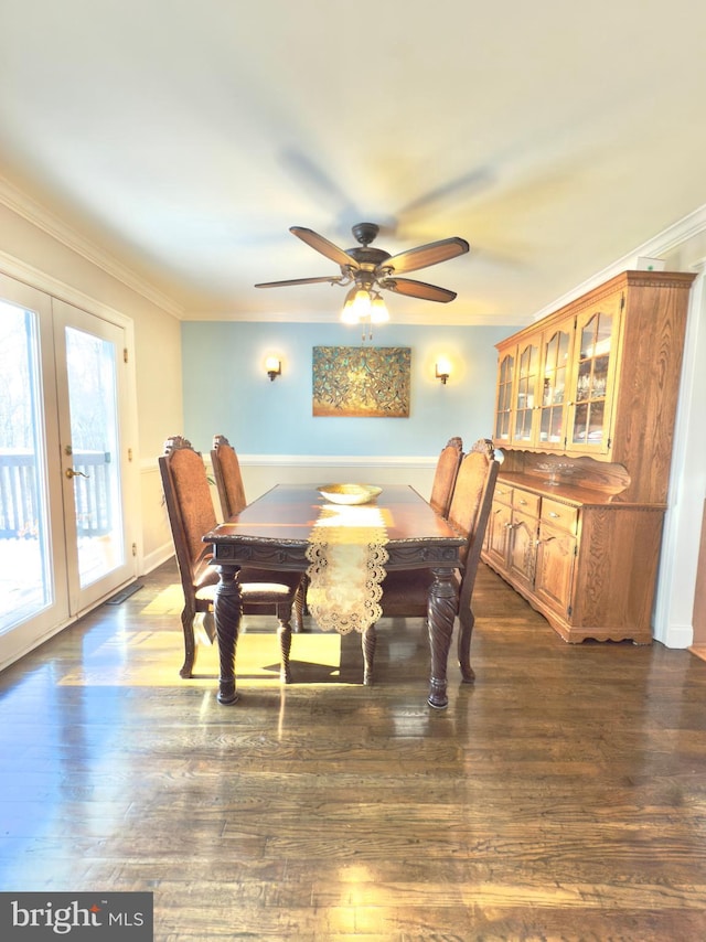 dining space featuring crown molding, ceiling fan, dark hardwood / wood-style flooring, and french doors