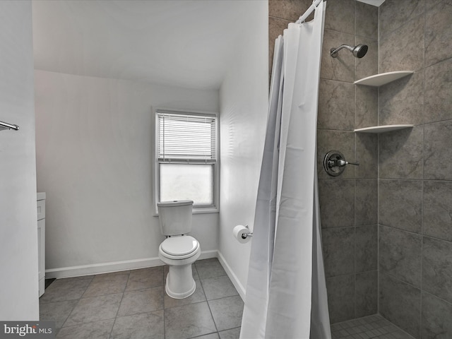 bathroom featuring walk in shower, toilet, and tile patterned floors