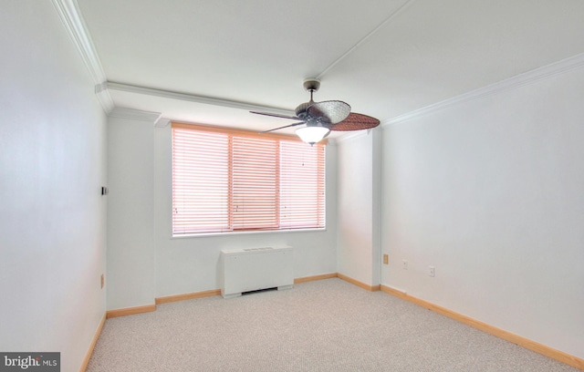 empty room with light colored carpet, ceiling fan, and ornamental molding