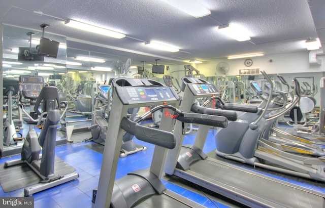 gym featuring a textured ceiling