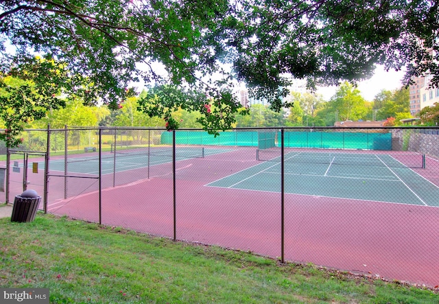 view of sport court featuring a yard