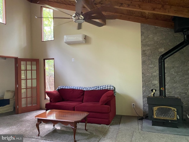 carpeted living room with beamed ceiling, high vaulted ceiling, a wood stove, ceiling fan, and an AC wall unit