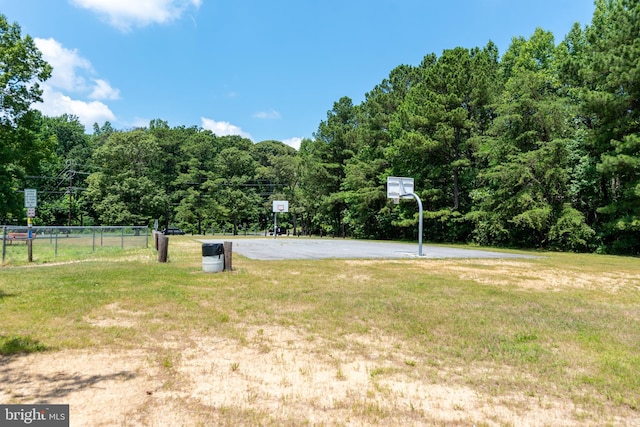 view of yard featuring basketball court