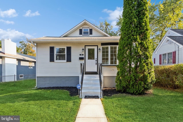 bungalow-style house featuring a front yard