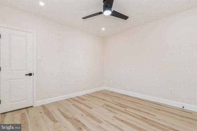 empty room featuring light wood-type flooring and ceiling fan