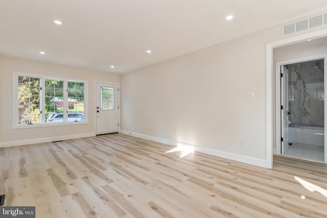 unfurnished room featuring light hardwood / wood-style flooring