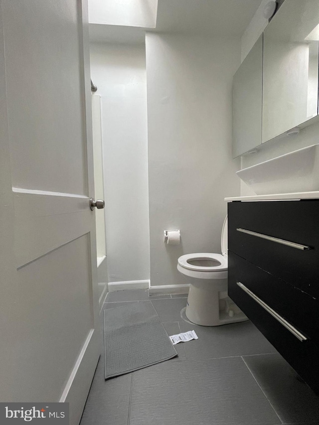 full bathroom featuring vanity, toilet, separate shower and tub, and tile patterned flooring