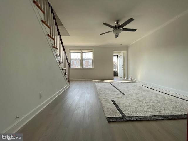 interior space featuring crown molding, ceiling fan, and hardwood / wood-style floors