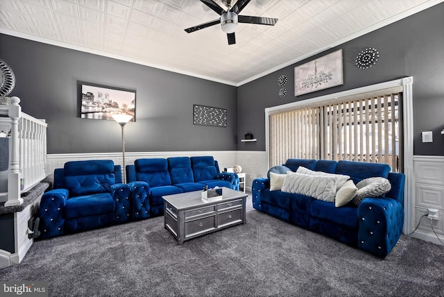 carpeted living room featuring crown molding and ceiling fan