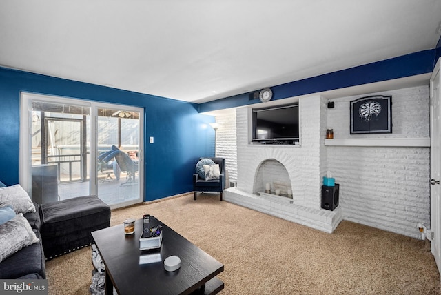 living room with carpet and a brick fireplace