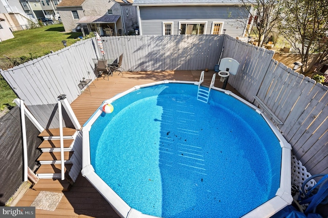 view of swimming pool featuring a deck